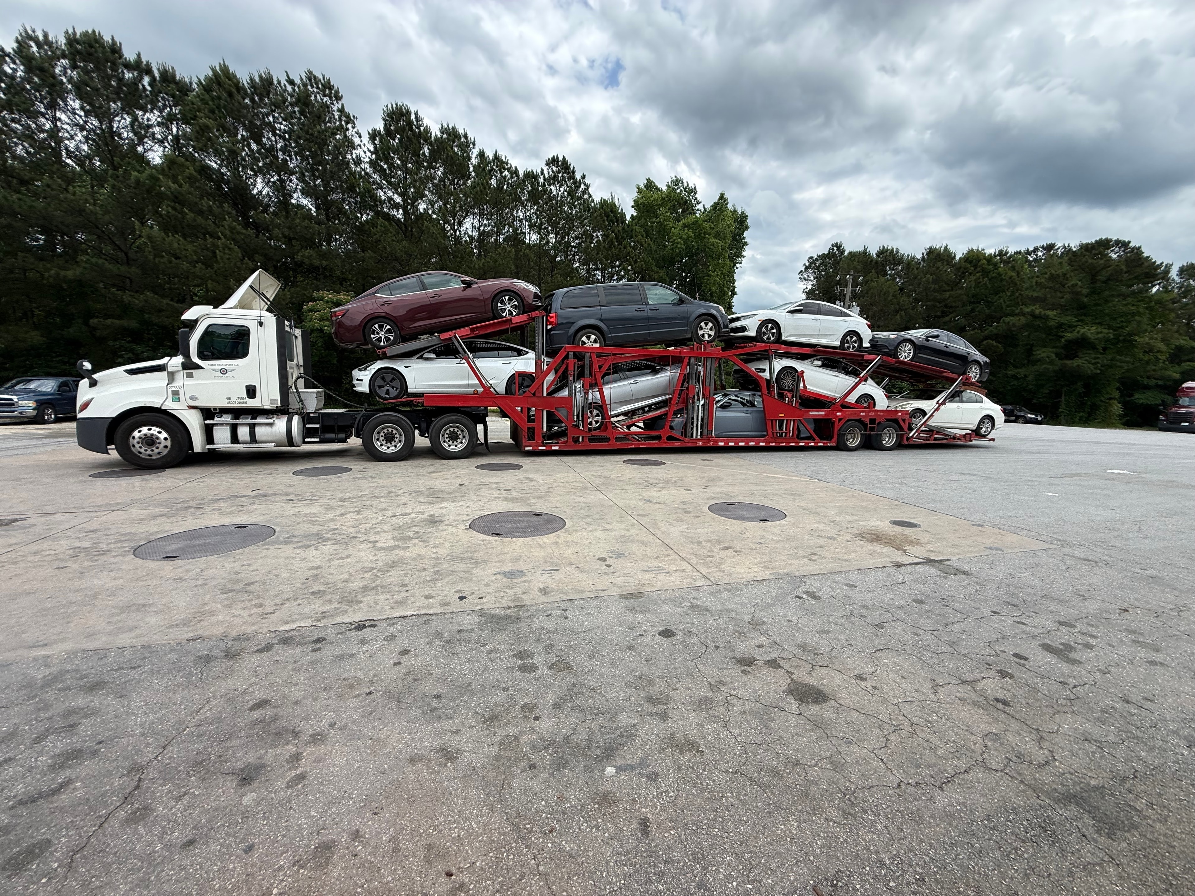 Aerial view of vehicle auction lot with rows of cars