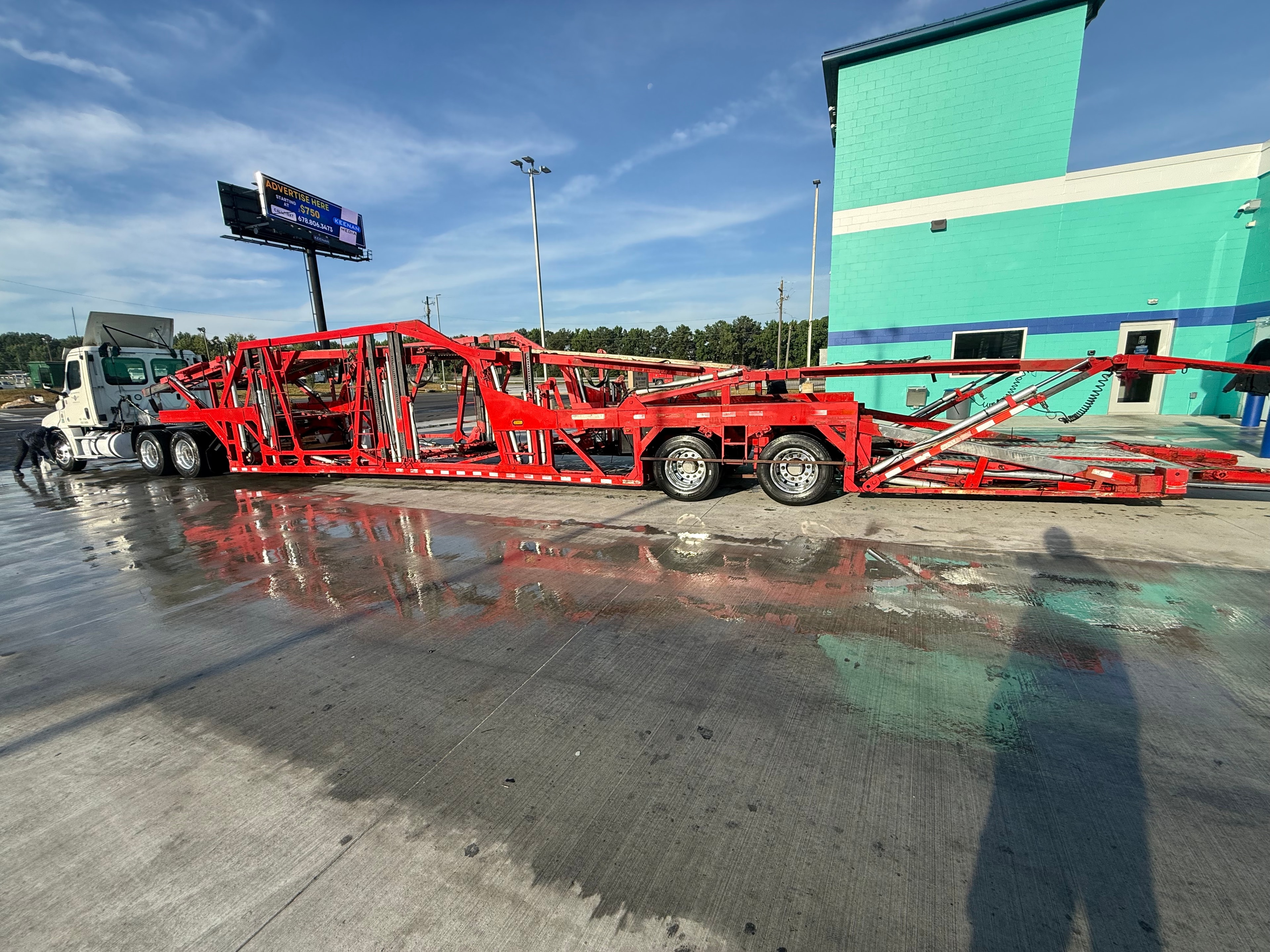 Inoperable vehicle being loaded onto tow truck for transport